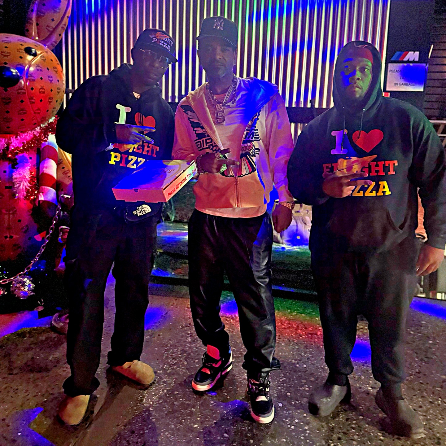 Crew in I Love Flyght Pizza tees at the night pop-up