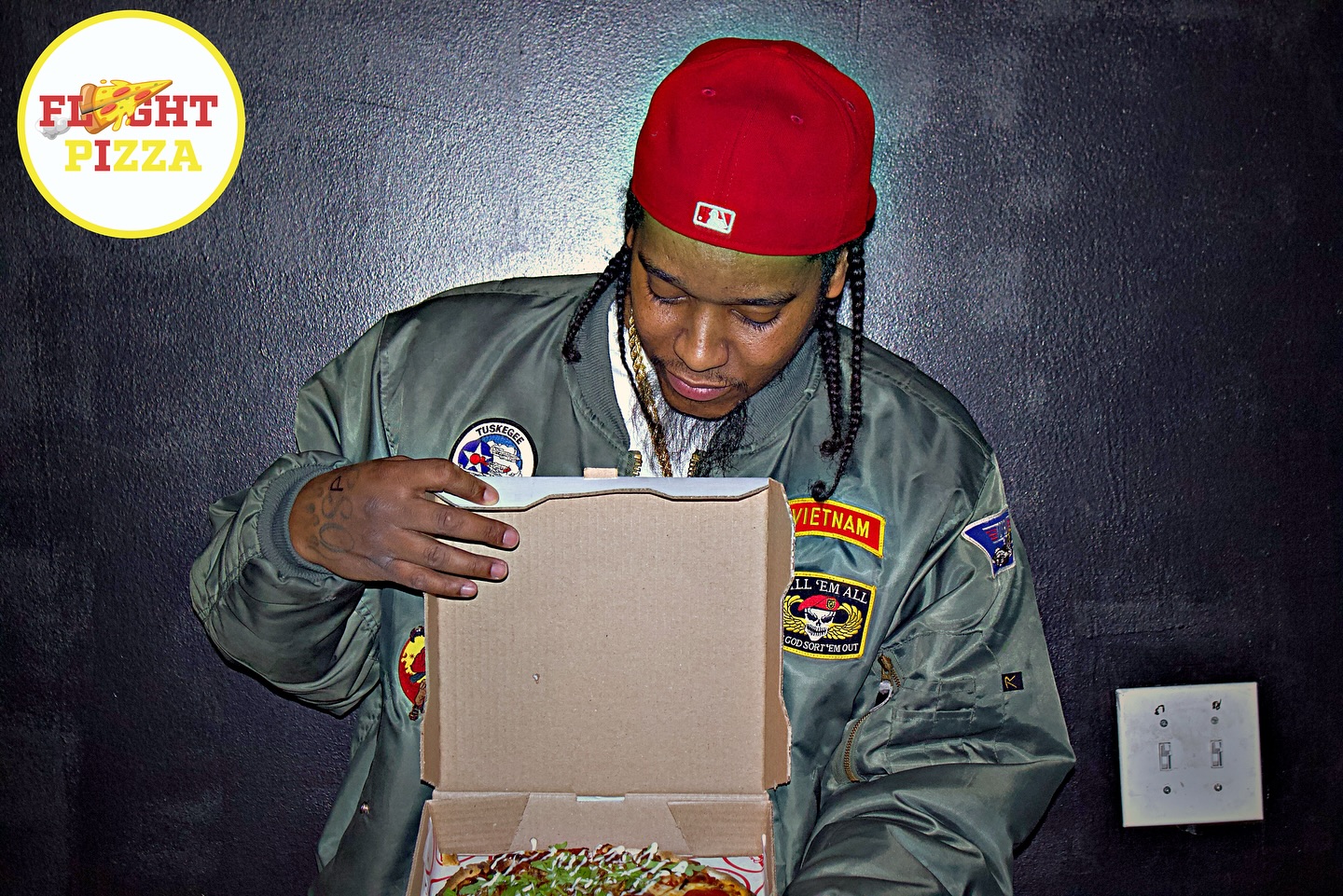 Customer opening a Flyght Pizza box